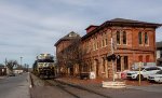 NS 4740 leads southbound coal train past the ex-PRR red brick depot